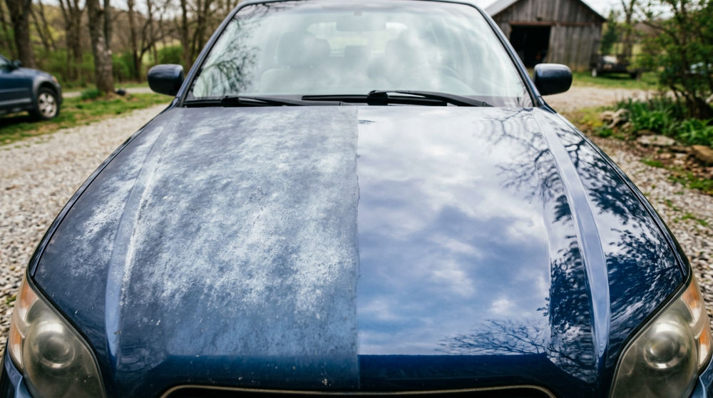 A visual comparison showing the difference between oxidized paint and a surface protected by regular car waxing.